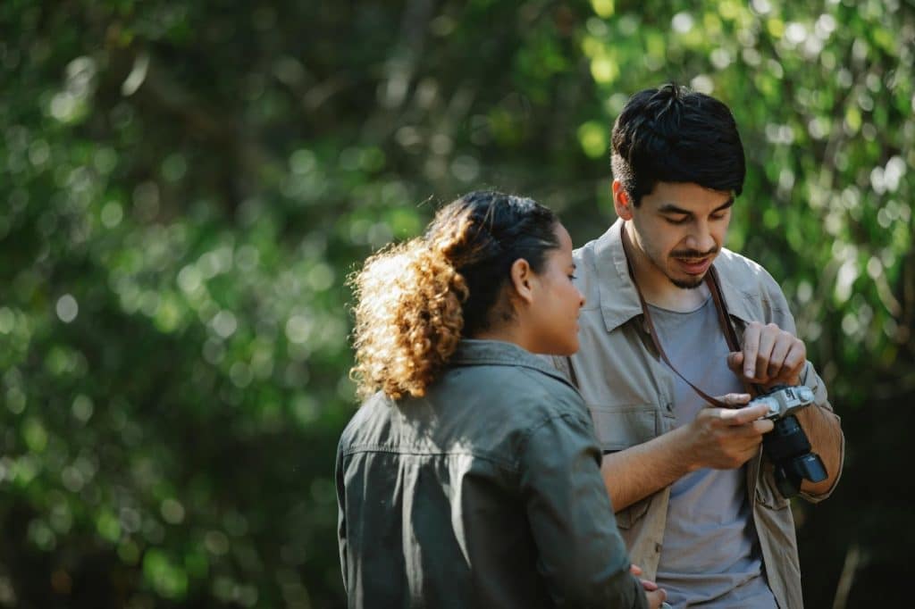 A man showing something to woman
