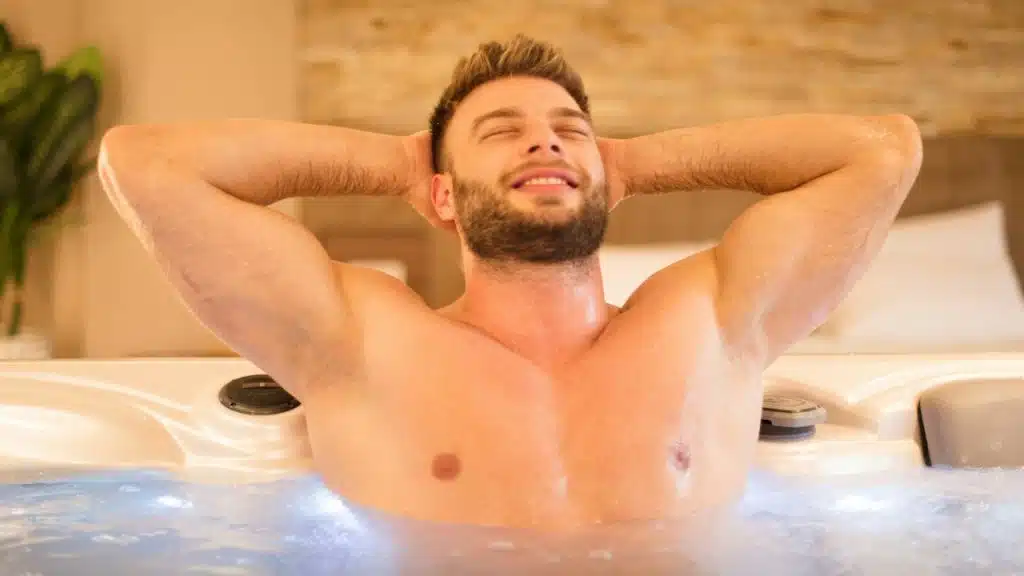 A man relaxing in a hot tub.