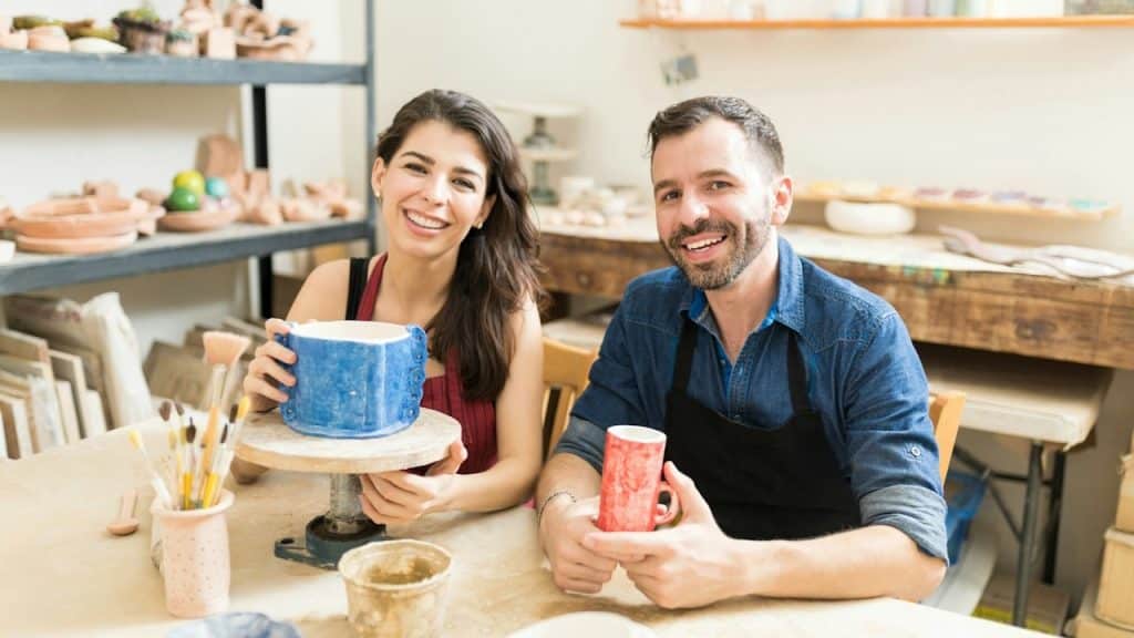 A couple in a pottery class.