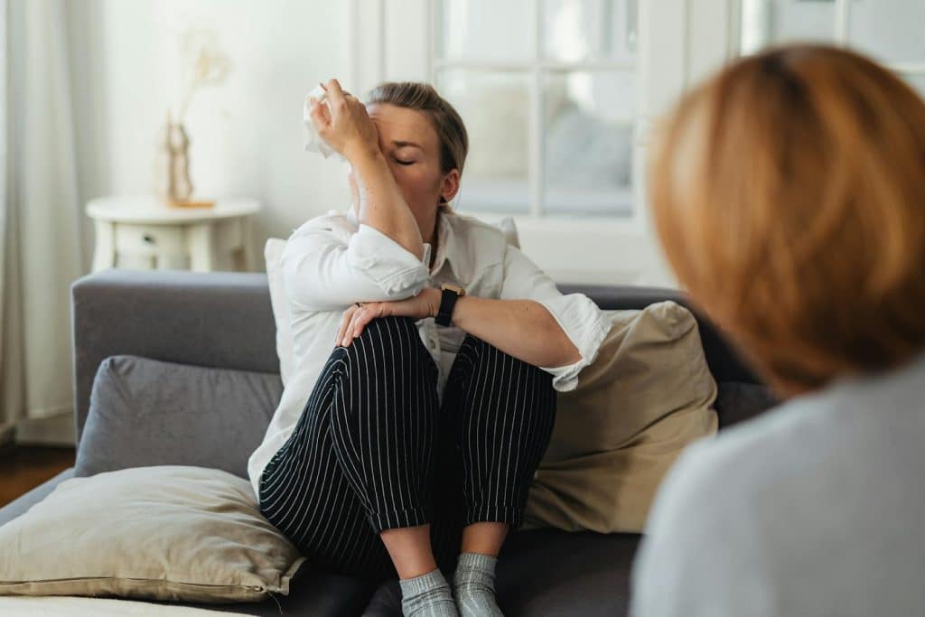 The woman is crying in front of her friend.