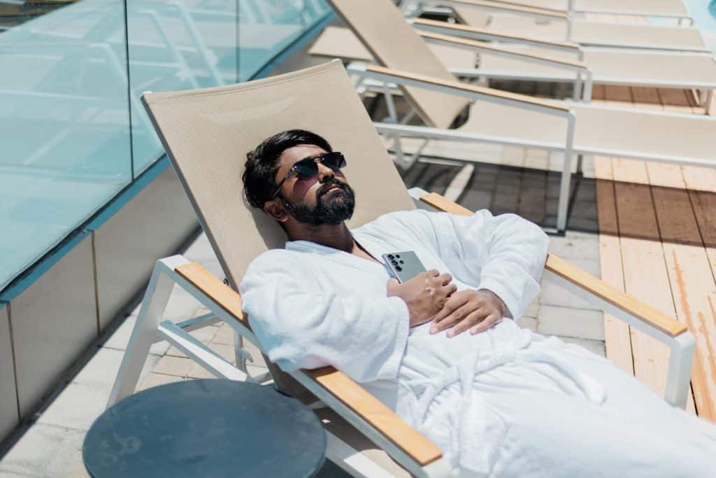 A man relaxing in a pool bed.