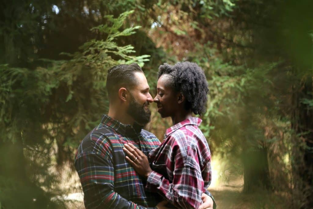 A couple looking at each other and smiling.