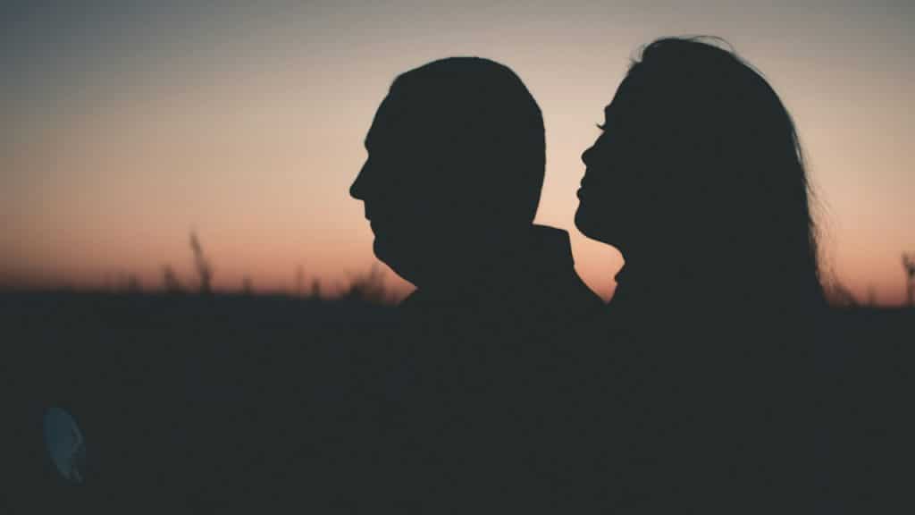 Man looking away from his partner.
