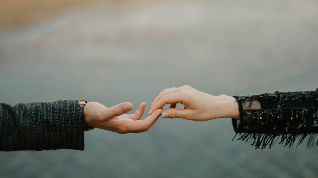 A couple leaving hands.
