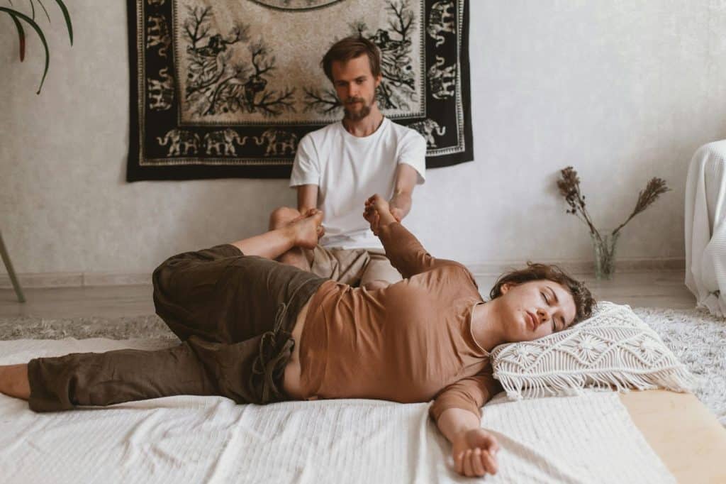 A man massaging a woman