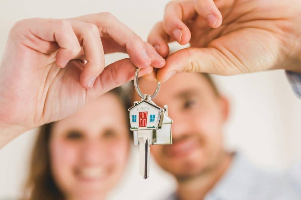 A man and woman having a couple keychain