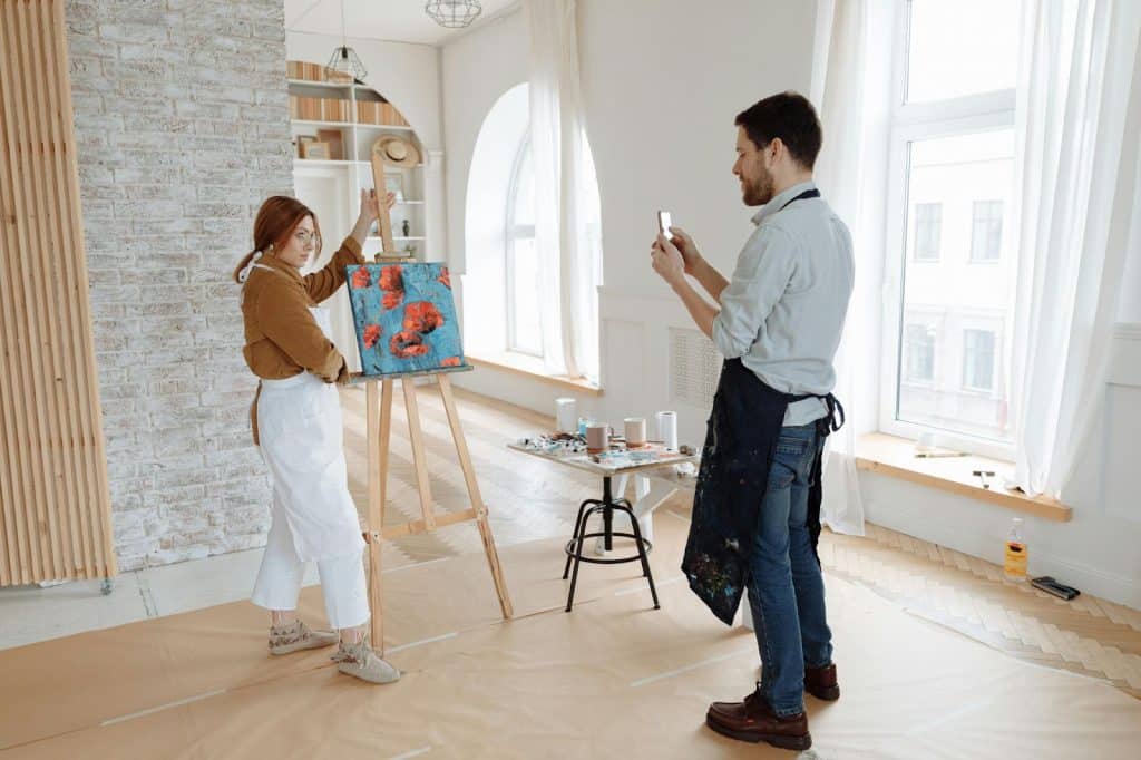 A man taking a picture of a woman