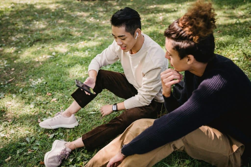 Two men using a phone