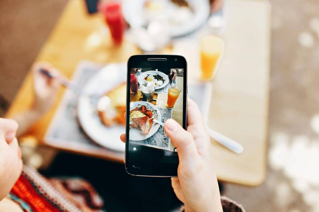A person taking a picture and posting it