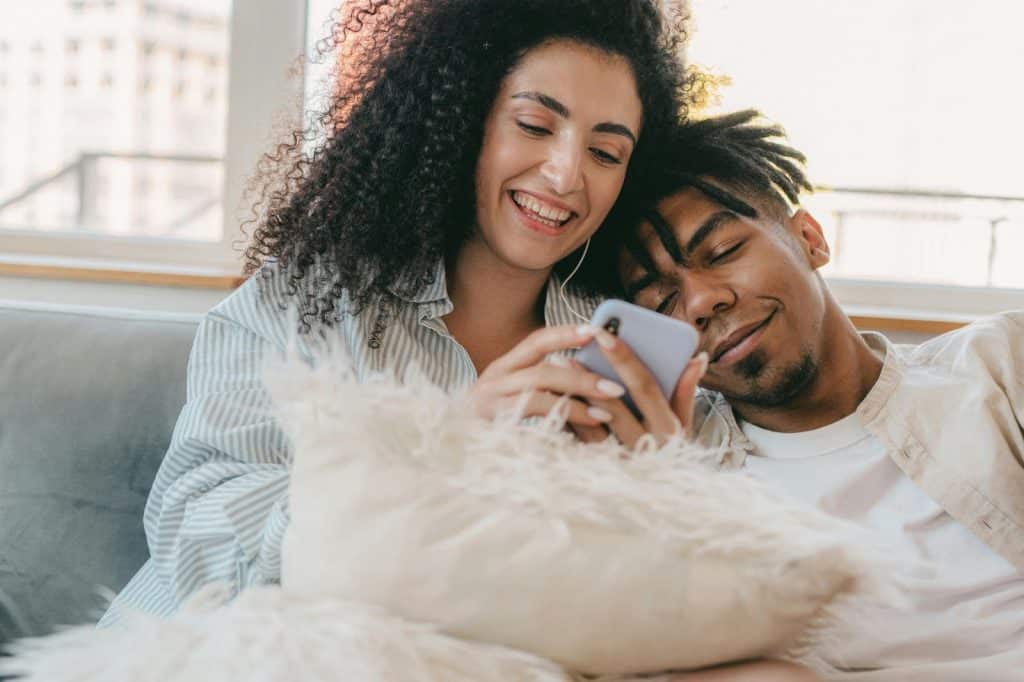A man and woman laughing at something