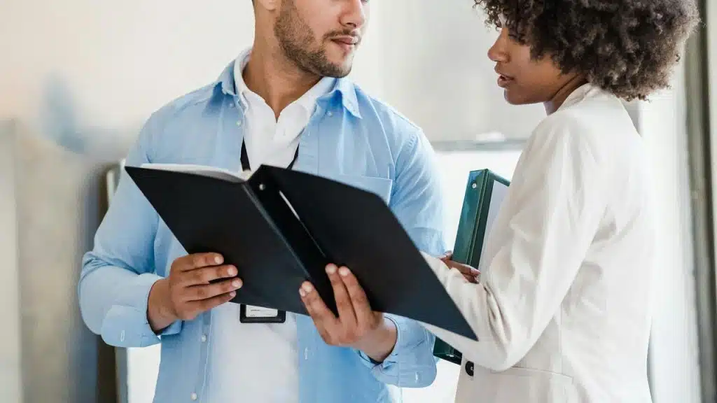 A man and a woman reviewing documents together.