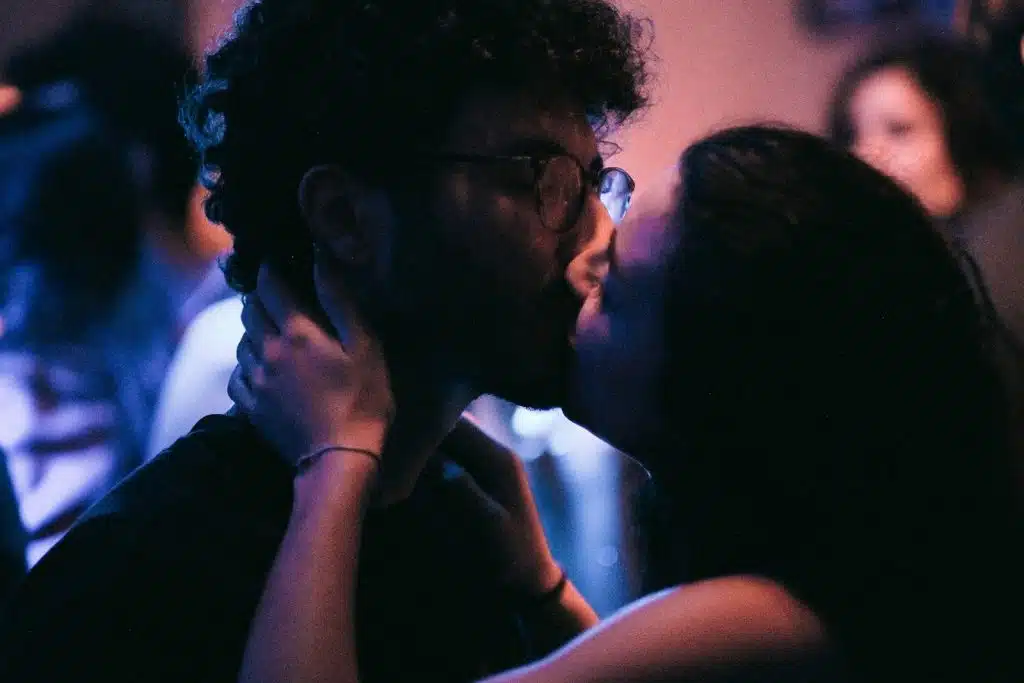 The man and woman are kissing each other.