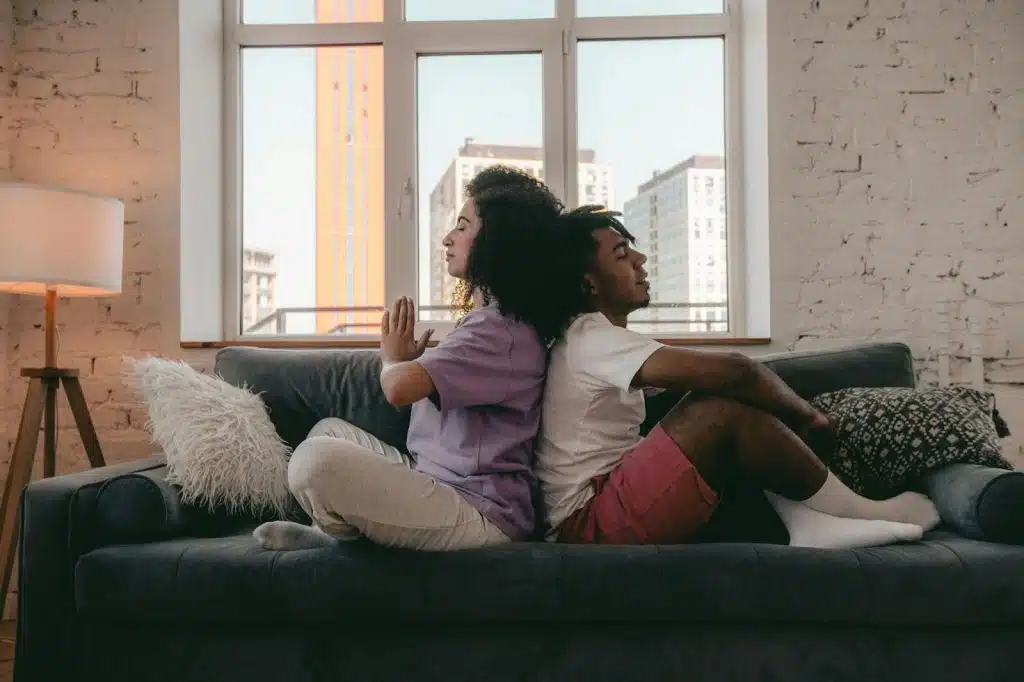 A man and woman meditating together