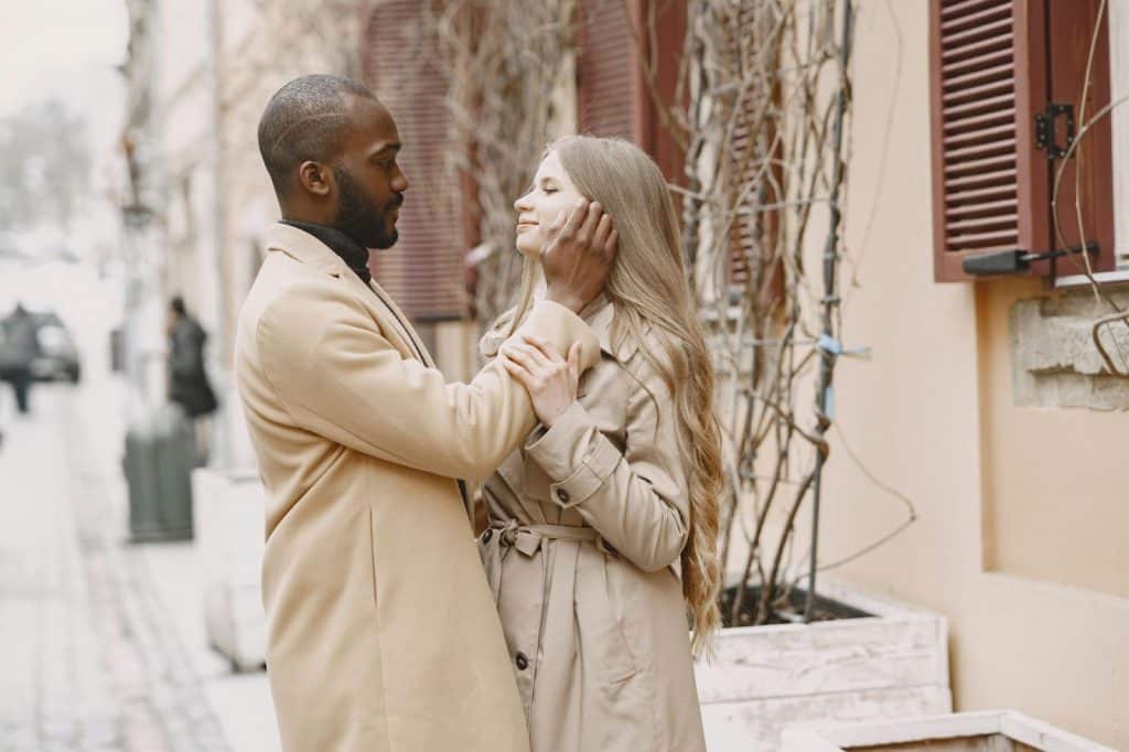 A man assuring a woman