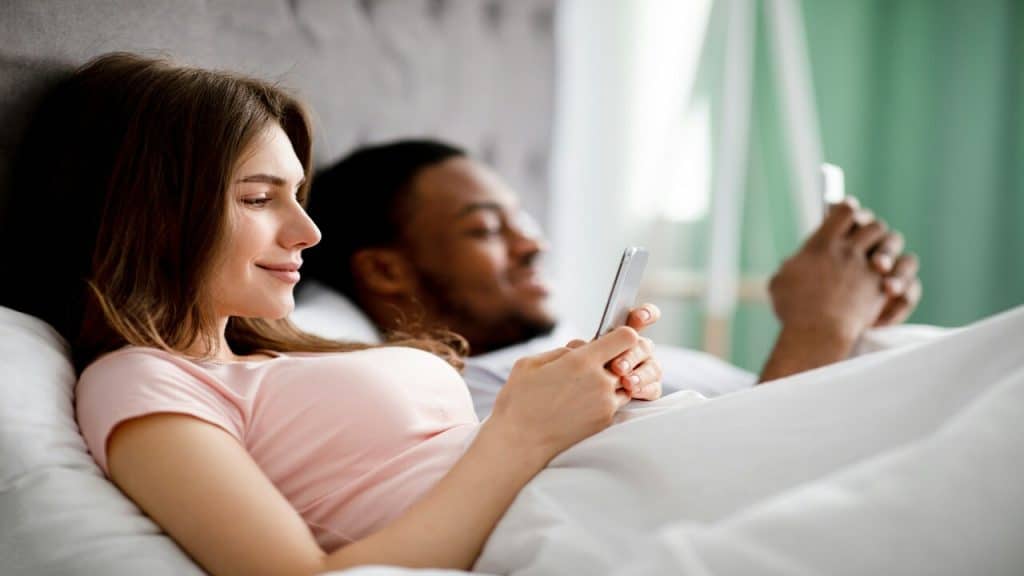 A couple busy with their phones