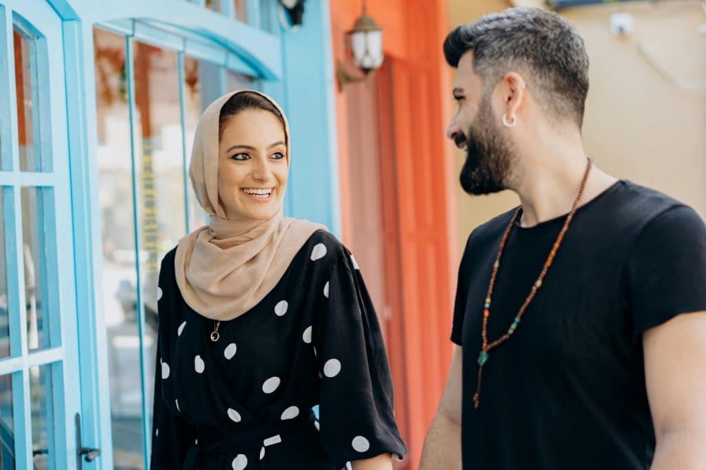 A man and woman smiling at each other