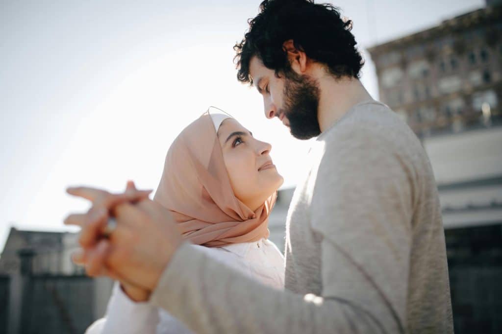 A man and woman facing each other