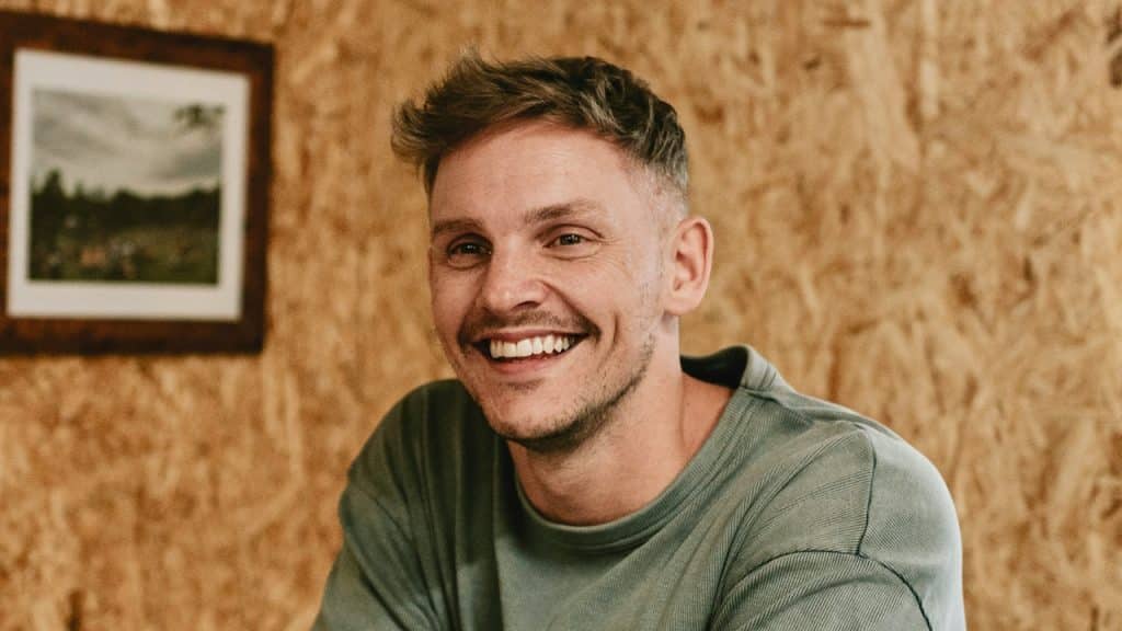 An attractive man smiling.