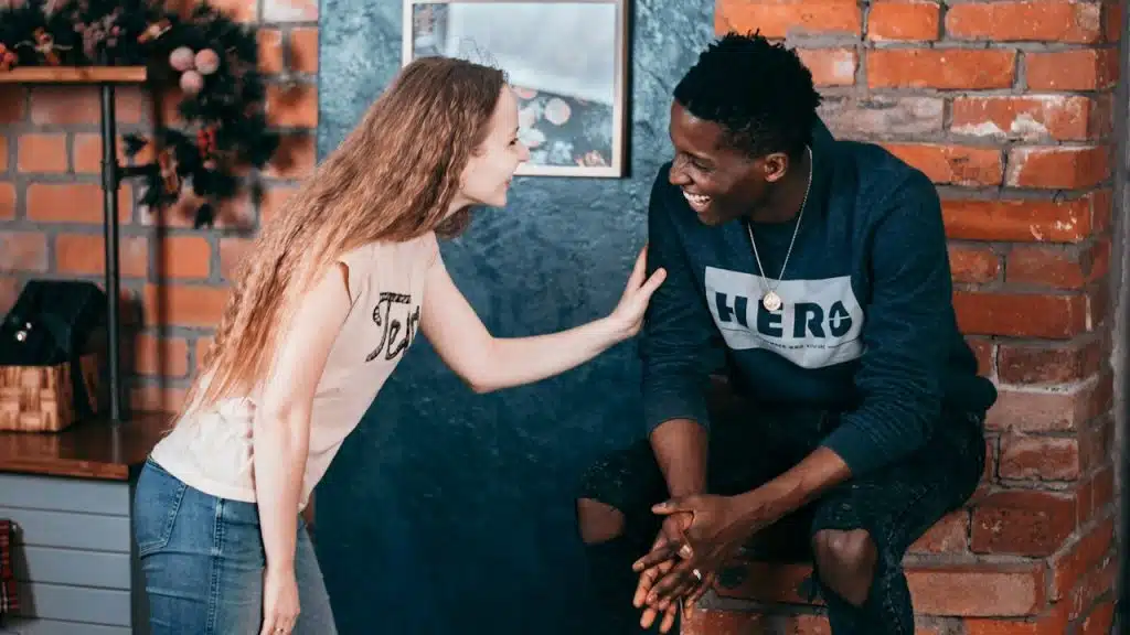 A couple laughing together.