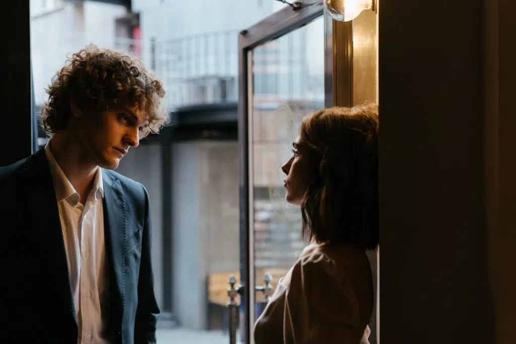 A Young Woman and a Man Having a Conversation