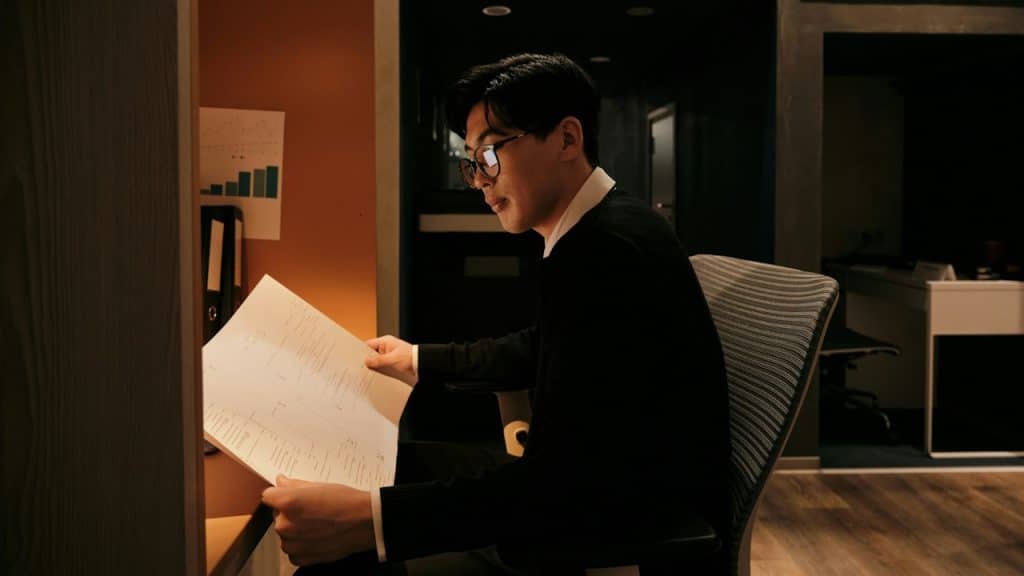 A man reading a script.
