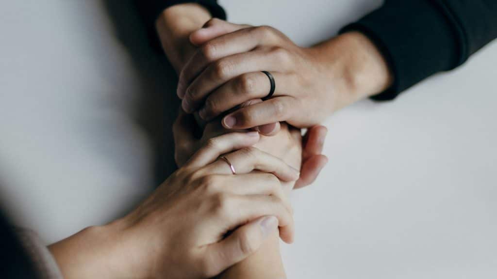 A couple holding hands.