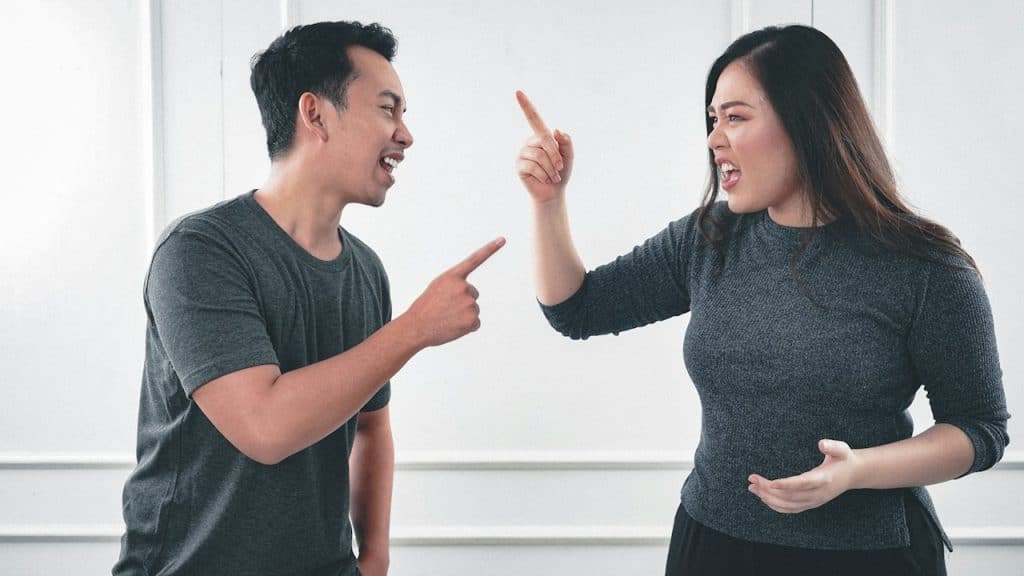 A couple arguing with each other.