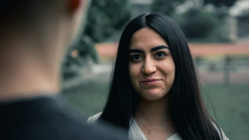 A woman smiling at her partner.