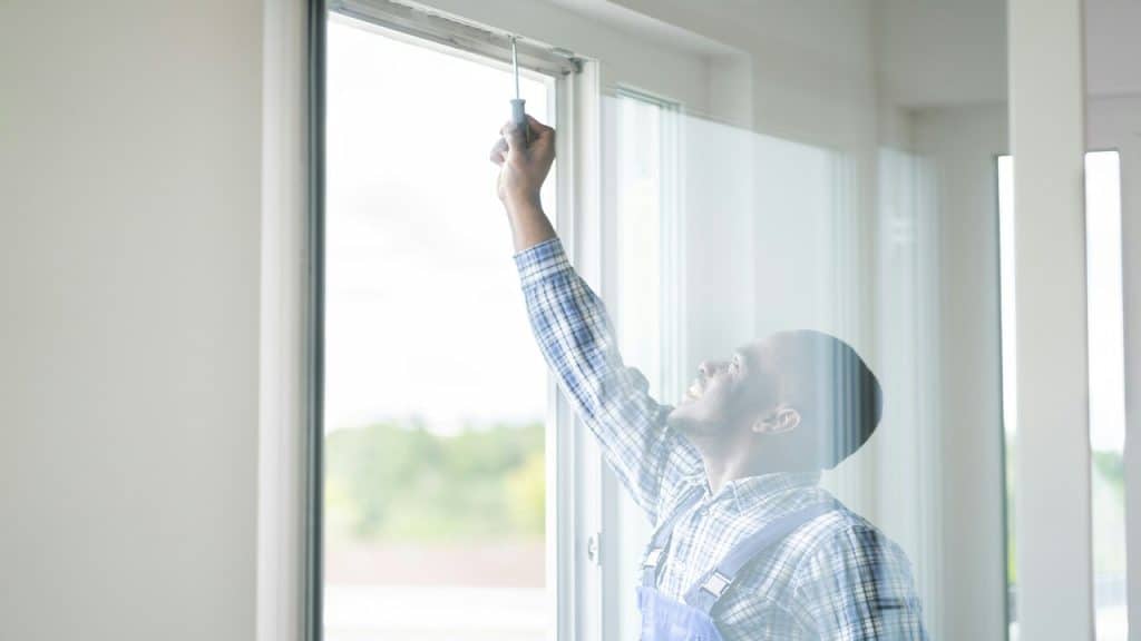 A man fixing the window