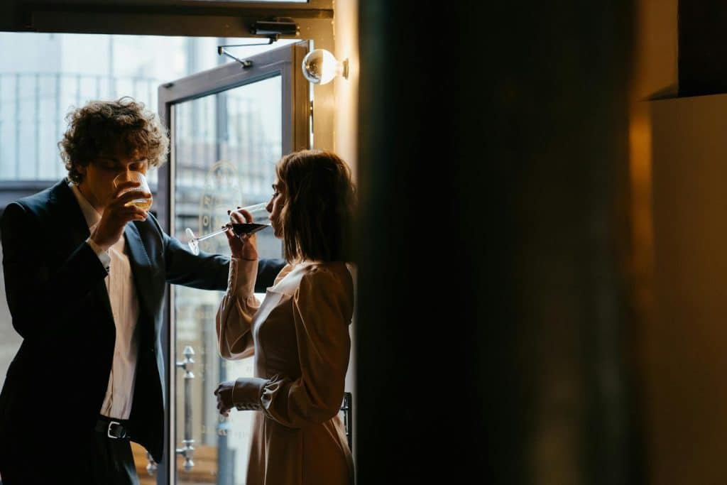The couple is drinking at a bar.