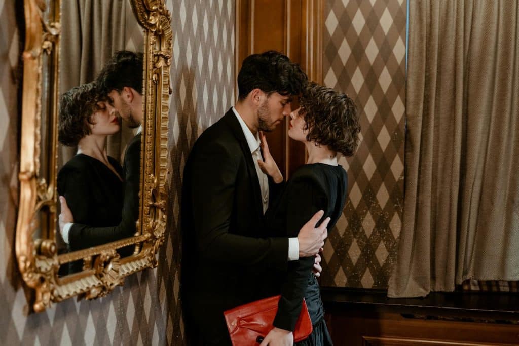 The couple is hugging.