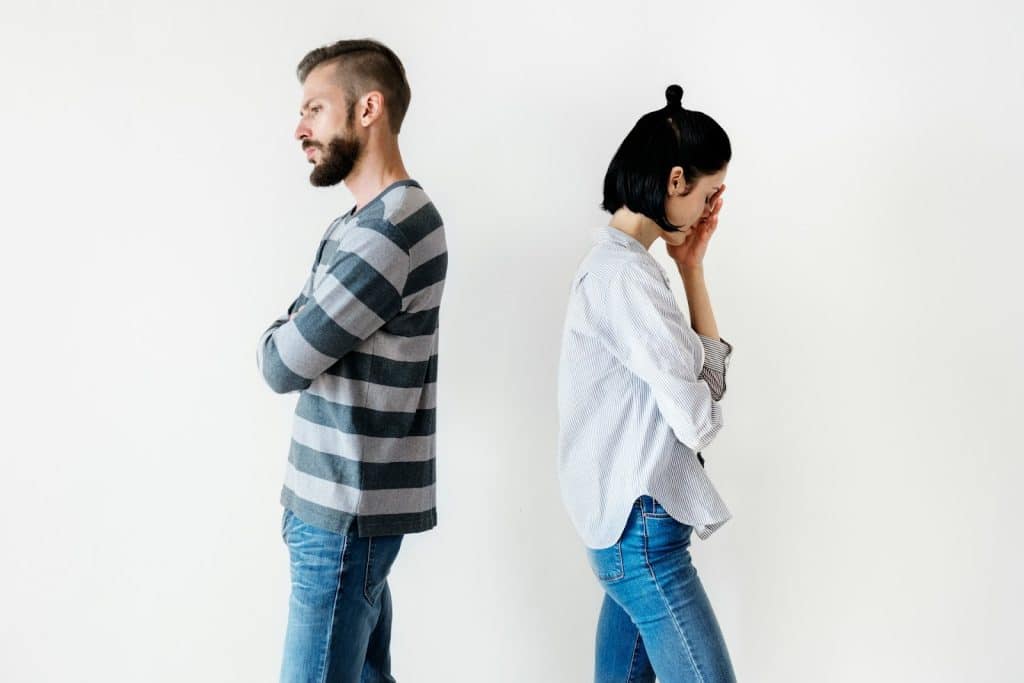 The man is ignoring the frustrated wife.