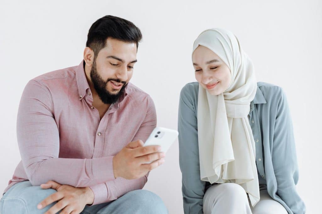 A man showing something to a woman