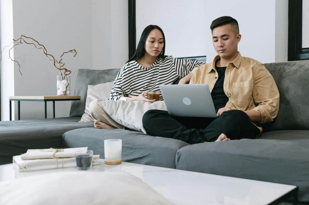 A man and woman at the couch