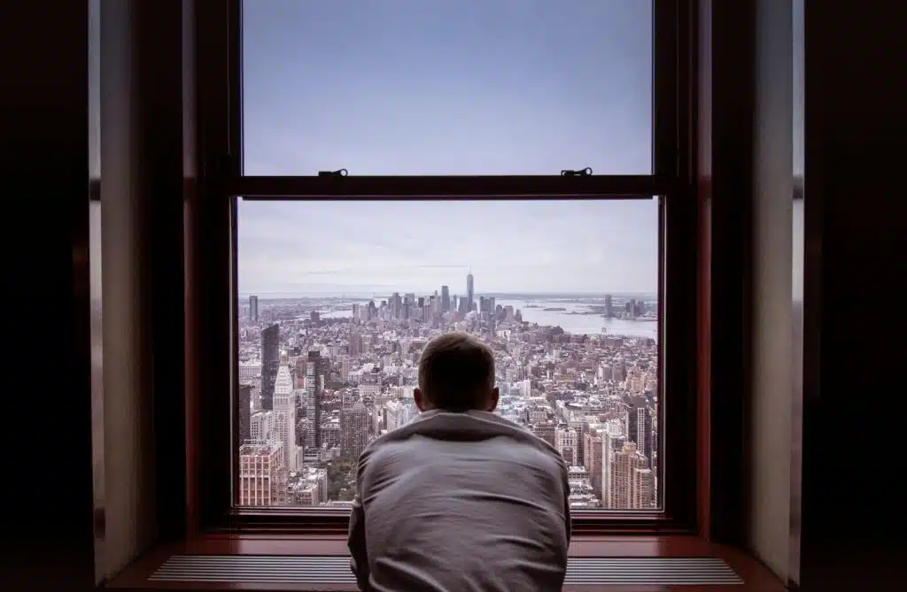 A man looking at the window
