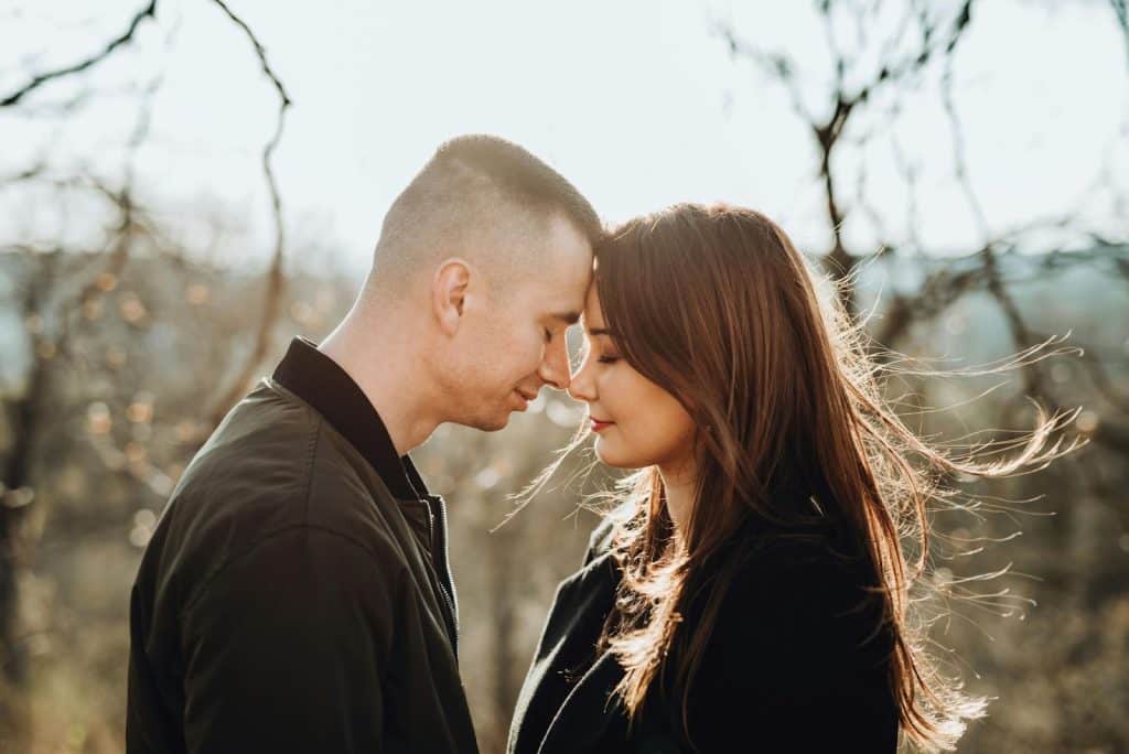 A man and woman facing each other