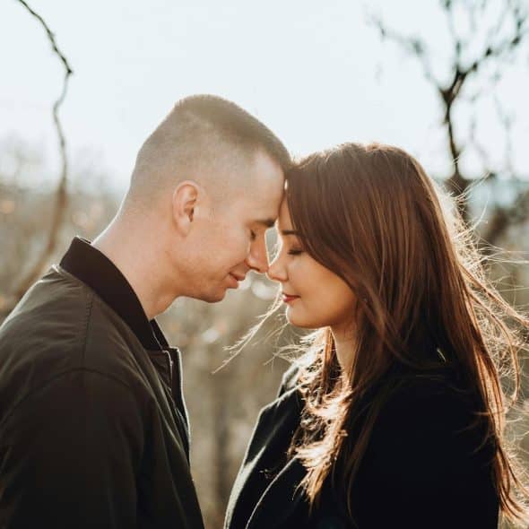 A man and woman facing each other