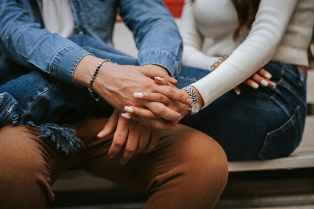 A man and woman holding hands