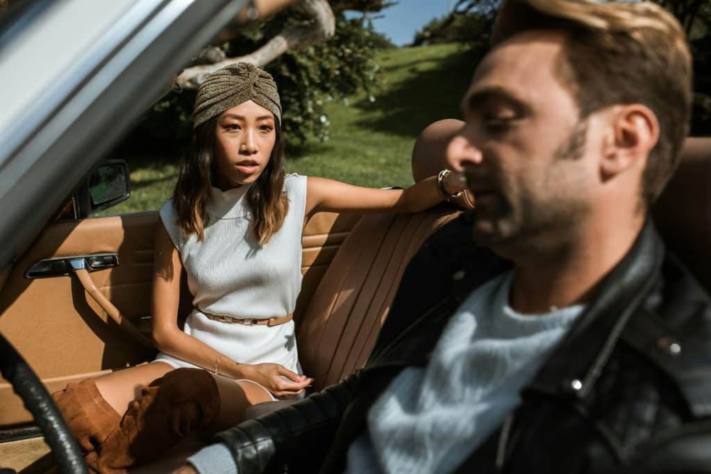 A woman looking at the man