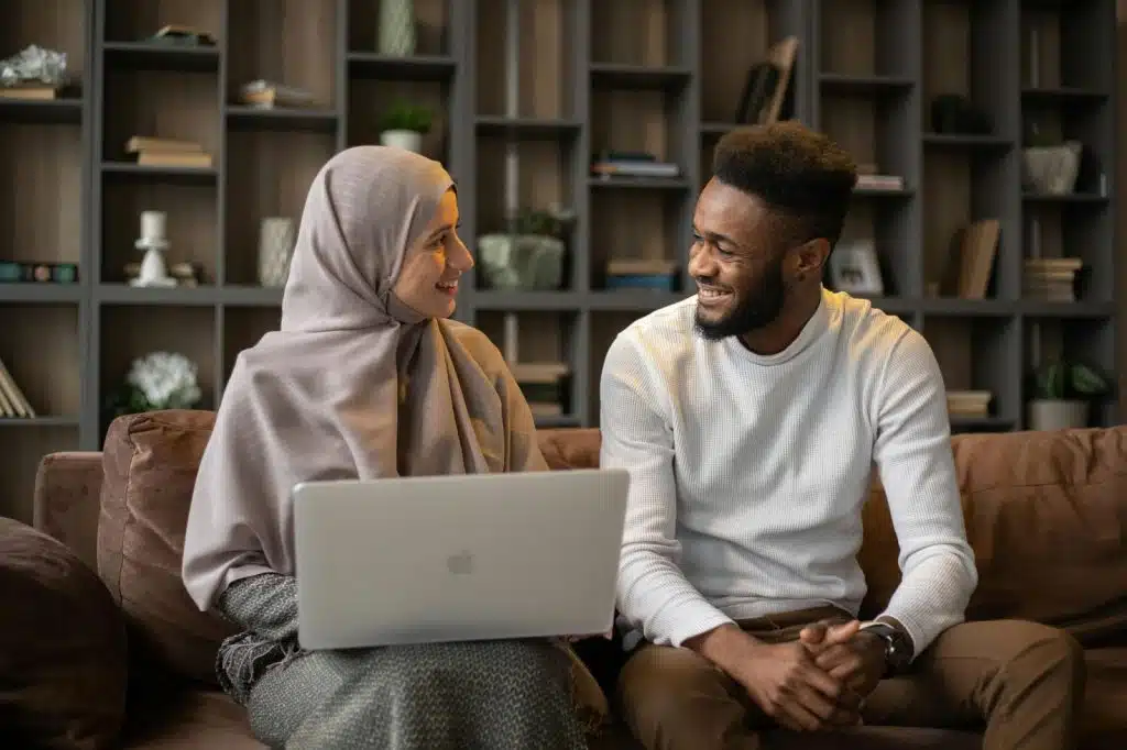 A man and woman smiling at each other