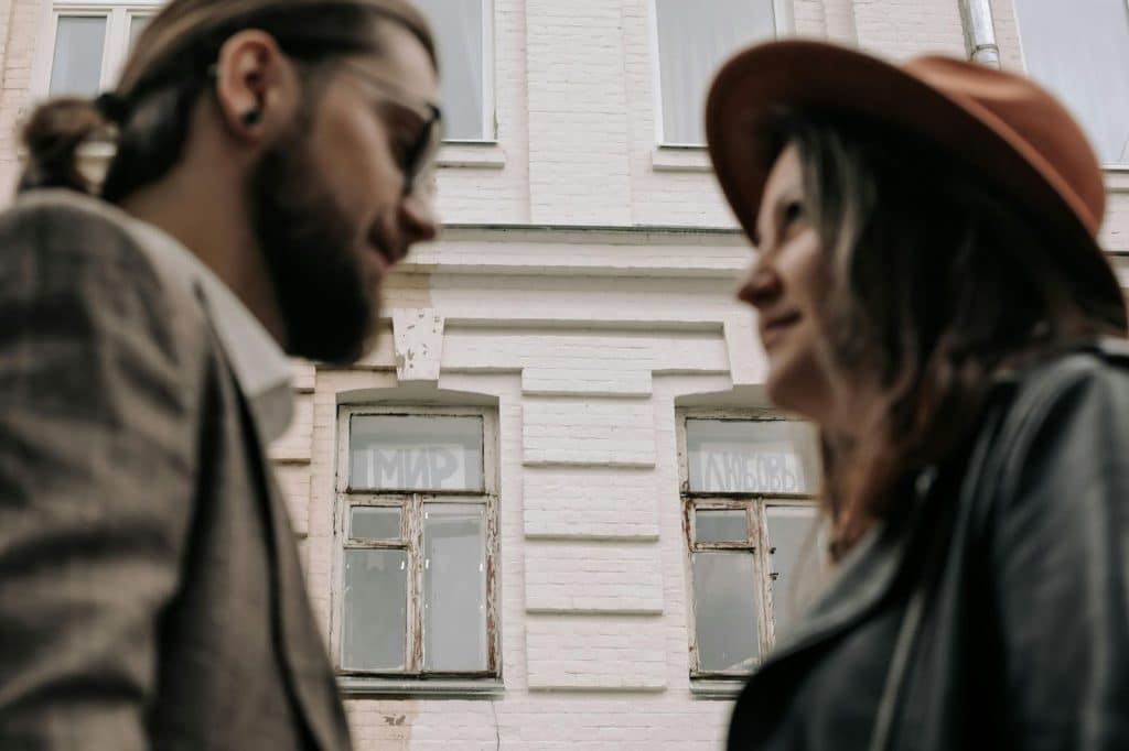 A man and woman looking at each other