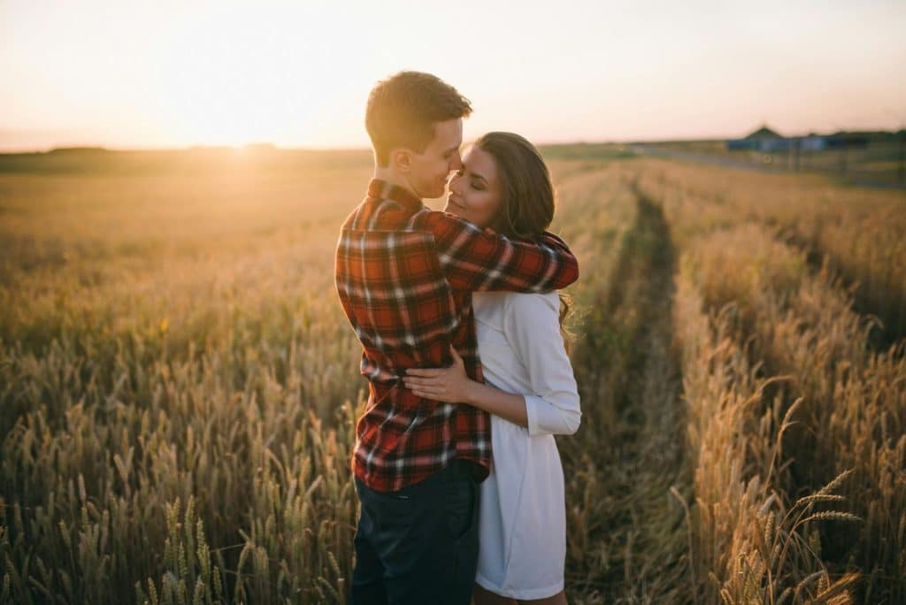 A man hugging a woman