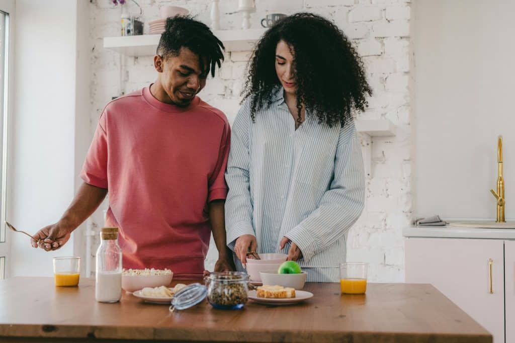 A man and woman at the kitchen
