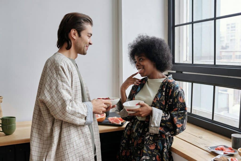 A man and woman smiling at each other
