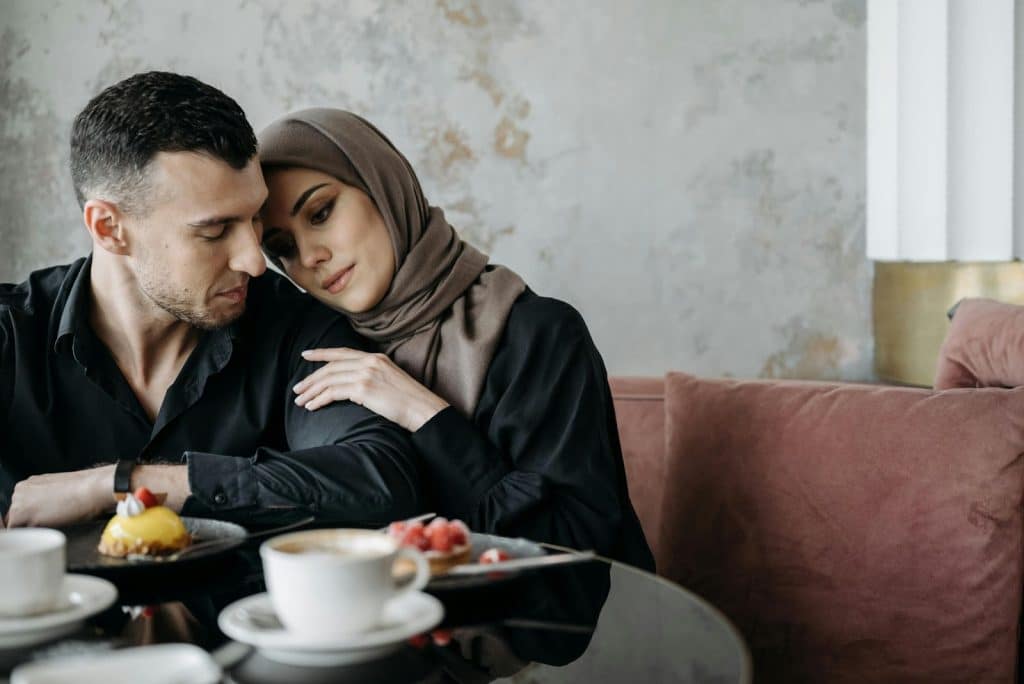 A woman leaning her head to a man