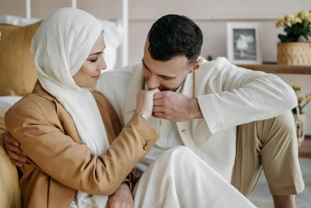 A man kissing a woman’s hand