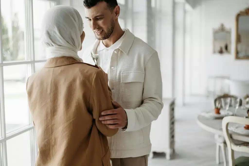 A man and woman facing each other