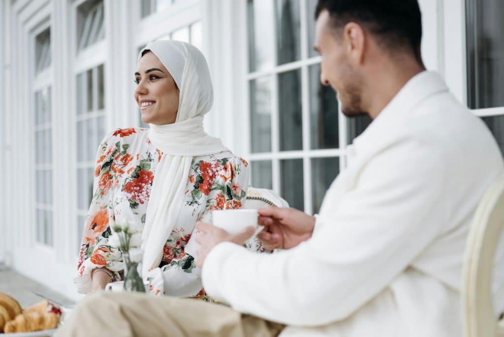 A man and woman having a coffee together
