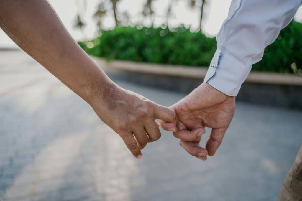 Couple holding hands