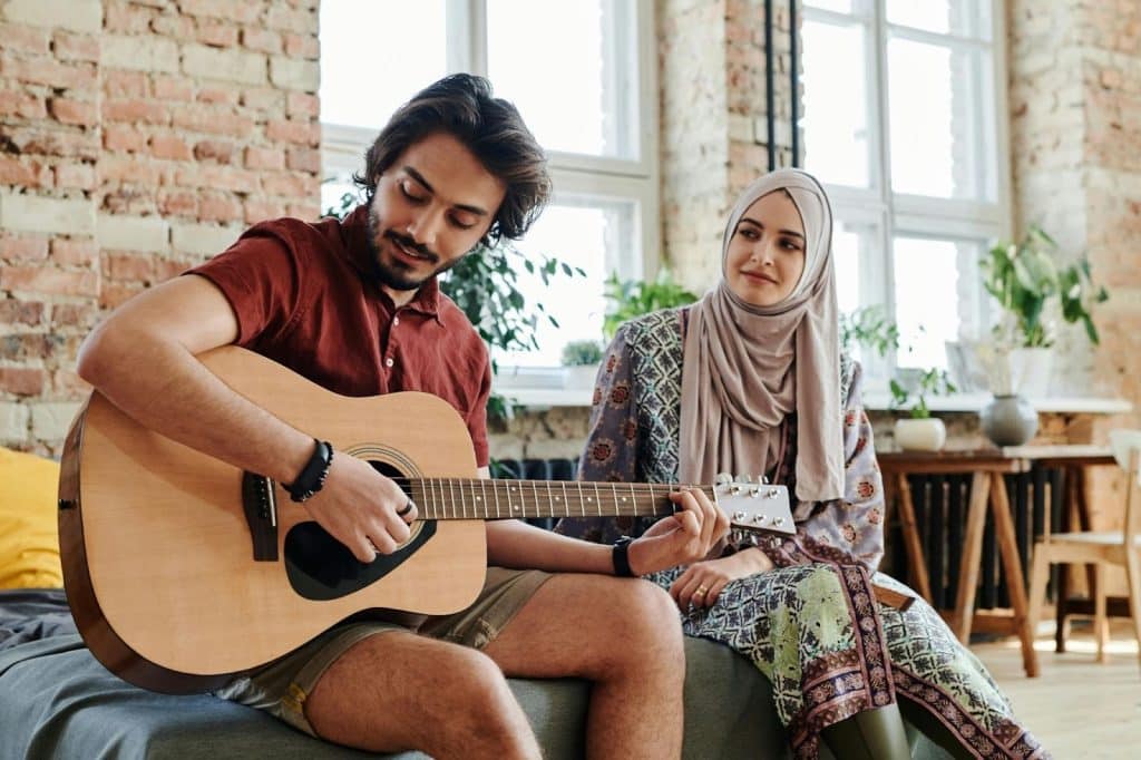 A man playing a guitar